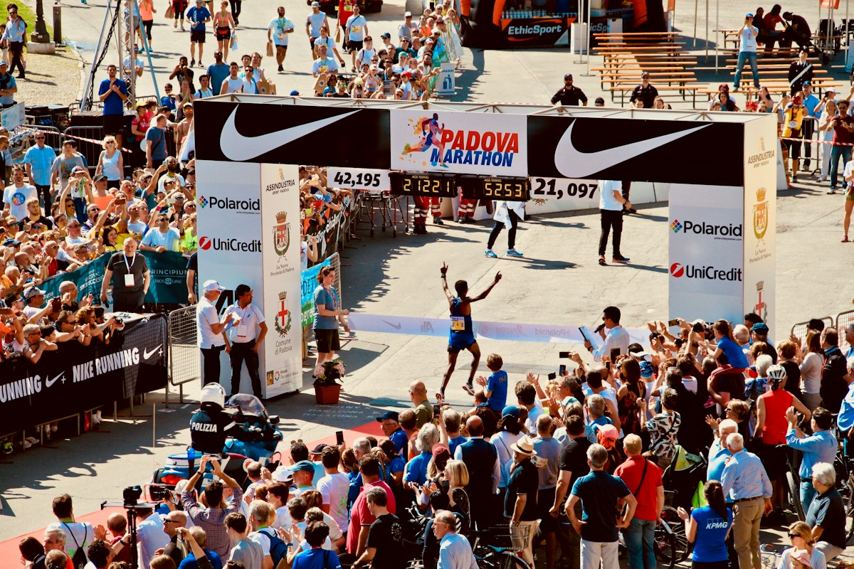 The finish arch of a marathon, surrounded by spectators