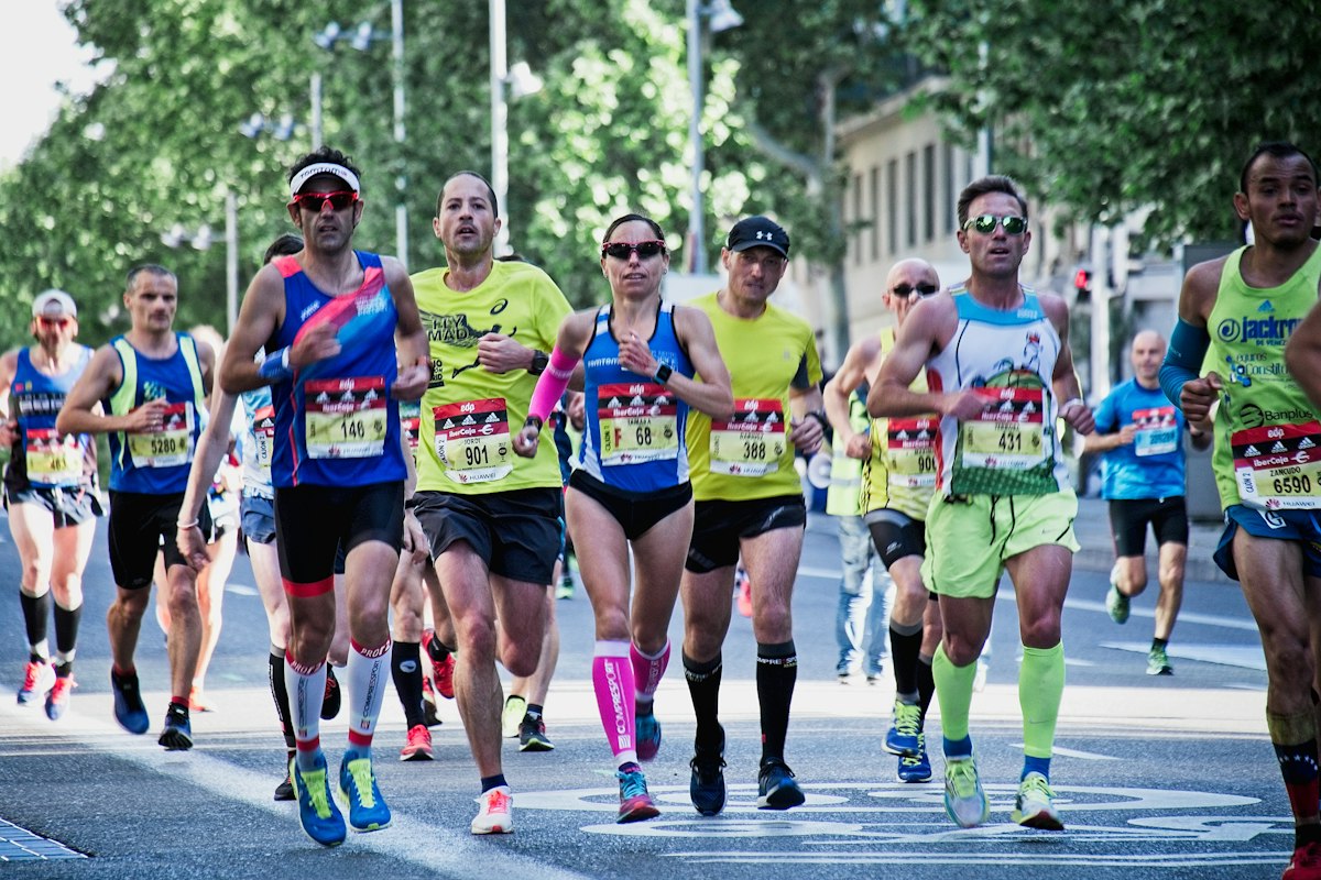 A pack of runners in a street, mid-race